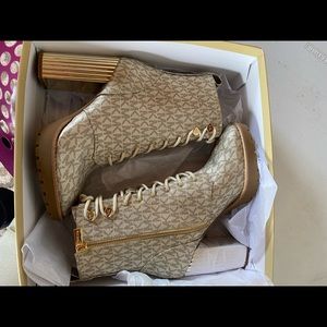 Size 8 Micheal Kors gold Porter Lace Up Bootie. Never worn.